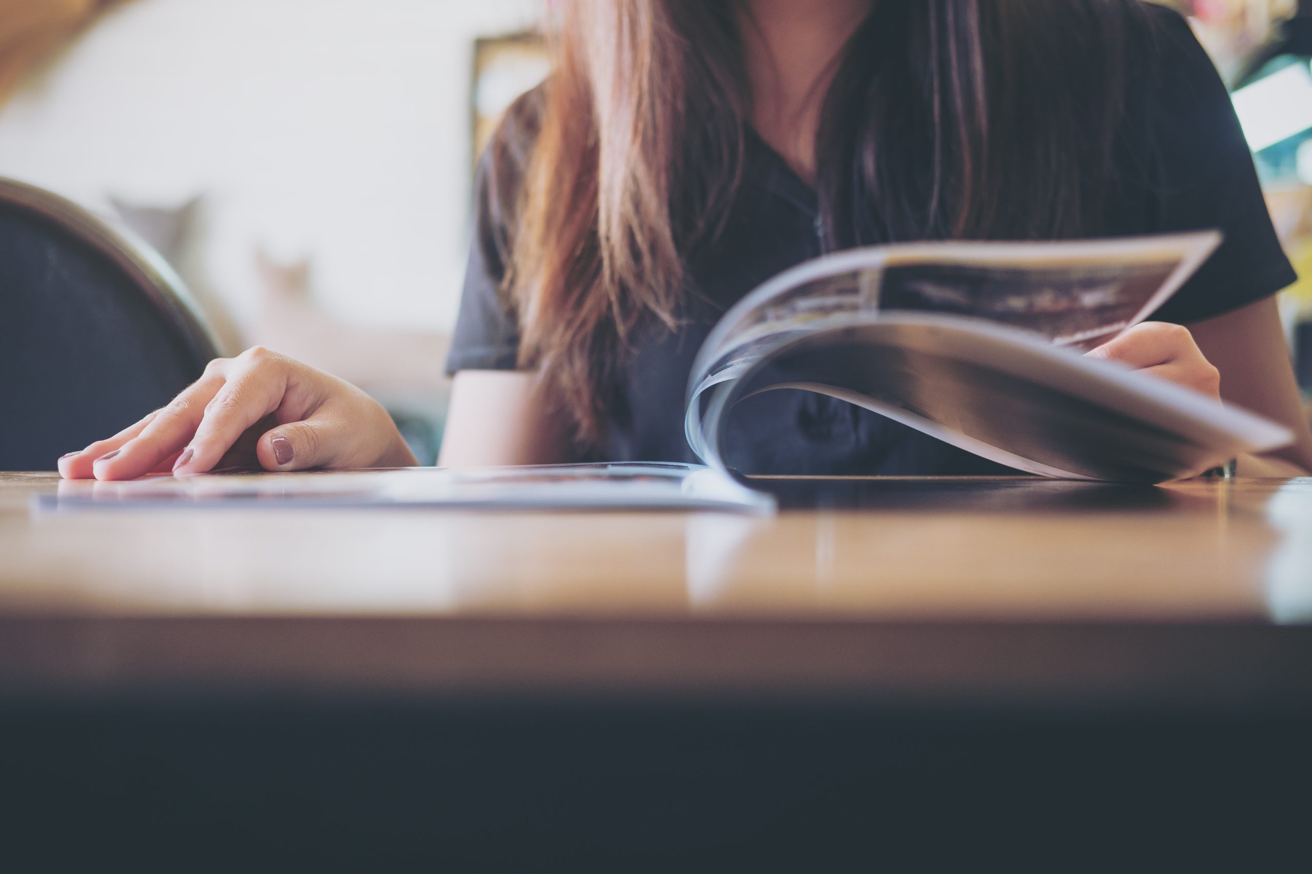 Closeup,Image,Of,A,Woman,Reading,A,Book,In,Modern